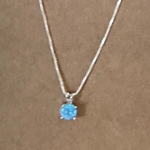 925 Sterling silver, round blue opal in pendant. 16” thin box chain.